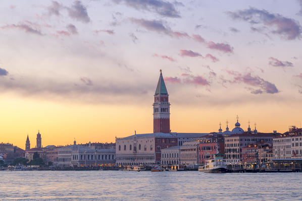 St. Mark's Campanile and Doge's Palace at sunset from Riva San Biasio at sunset, Venice, Veneto, Italy.