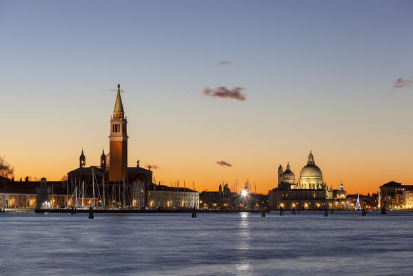 St. George's Island and Church of Santa Maria della Salute from Riva San Biasio at dusk, Venice, Veneto, Italy