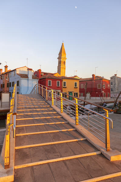 The typical colored houses and the leaning bell tower of Burano Island, Venice, Veneto, Italy.