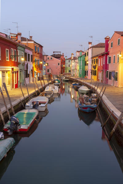 The typical colored houses with Rio di San Mauro Canal at dusk, Burano Island, Venice, Veneto, Italy.