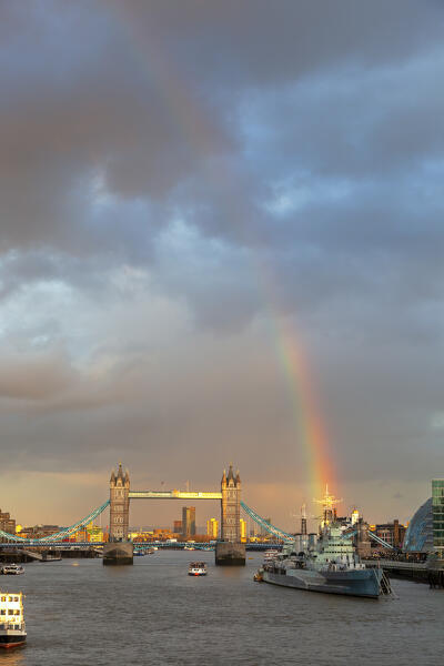 Tower Bridge and HMS Belfast from London Bridge at sunset with rainbow, London, Great Britain, UK