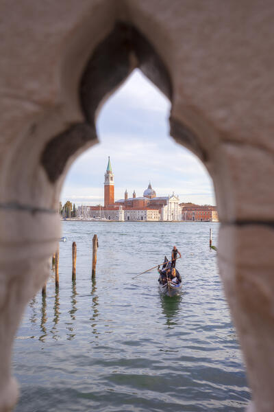 A gondola with St. George's island friom Ponte della Paglia, Venice, Veneto, Italy.