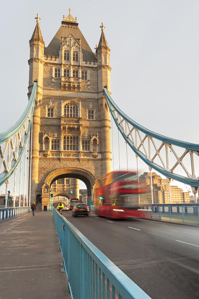 A traditional red bus on Tower Bridge, London, Great Britain, UK