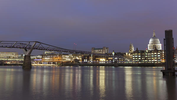 Evening lights on Millennium Bridge and dome of St. Paul’s Cathedral, London, Great Britain, UK