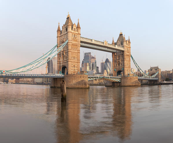 City of London framed by Tower Bridge at dawn, London, Great Britain, UK
