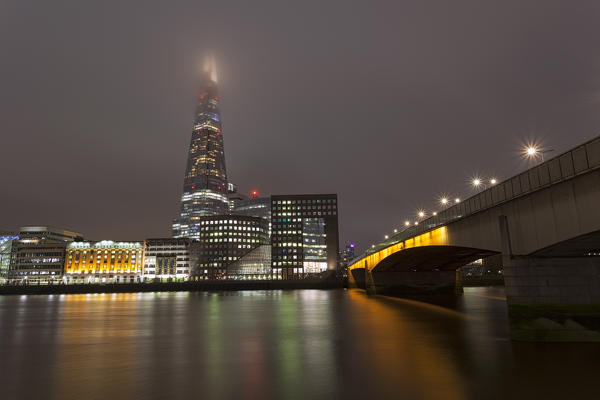 The Shard and the London Bridge in a cloudy evening, London, Great Britain, UK