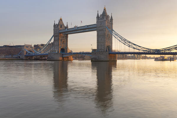 Tower Bridge at sunrise reflected in river Thames, London, Great Britain, UK