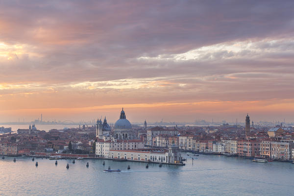 View of Punta della Dogana with church of Santa Maria della Salute from the bell tower of abbey of San Giorgio Maggiore at sunset, Venice, Veneto, Italy
