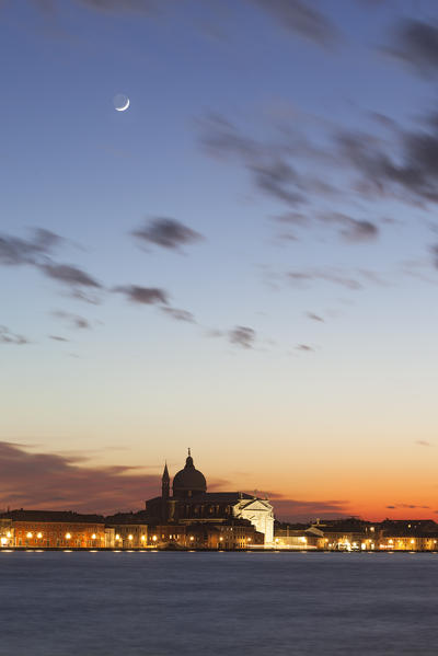 Redentore Church under the moon at dusk, Giudecca Island, Venice, Veneto, Italy