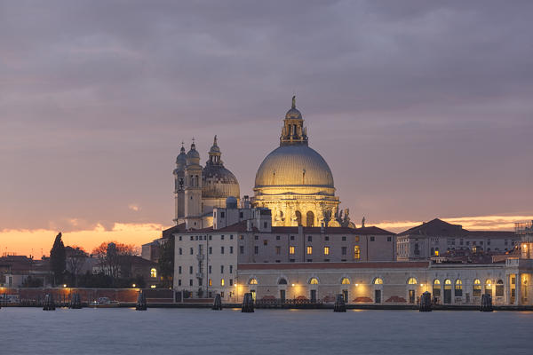 View of church of Santa Maria della Salute from San Giorgio Maggiore island at dusk, Venice, Veneto, Italy