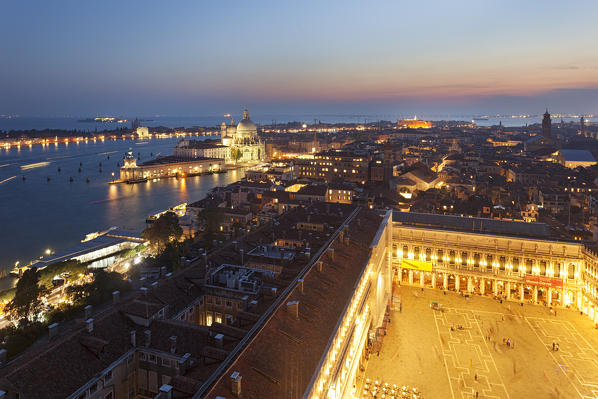 Santa Maria della Salute and St. Mark's Square seen from the top of St. Mark's Campanile at dusk, Venice, Veneto, Italy.