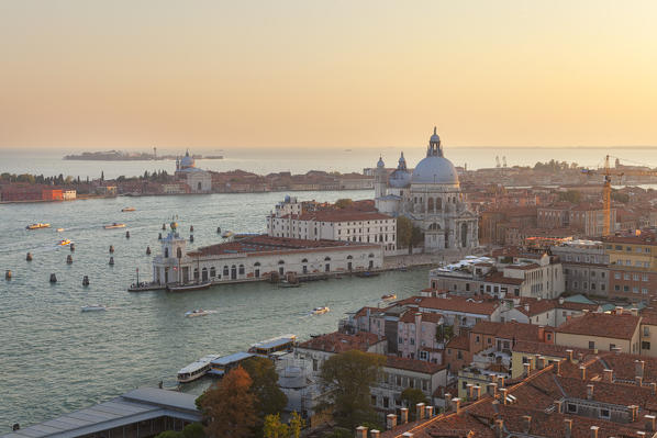 Santa Maria della Salute and Punta della Dogana seen from the top of St. Mark's Campanile at sunset, Venice, Veneto, Italy.