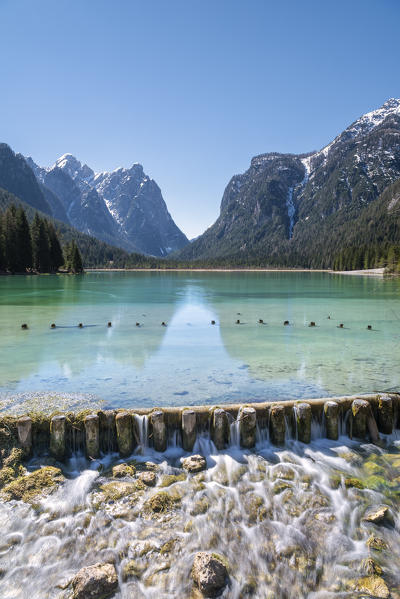 Dobbiaco/Toblach, Dolomites, South Tyrol, Italy. The lake Dobbiaco with the peaks of Croda dei Baranci and Croda Bagnata.