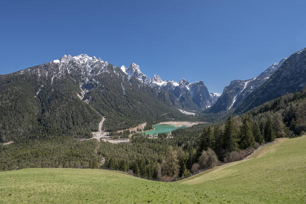 Dobbiaco/Toblach, Dolomites, South Tyrol, Italy. The lake Dobbiaco with the peaks of Croda dei Baranci and Croda Bagnata.