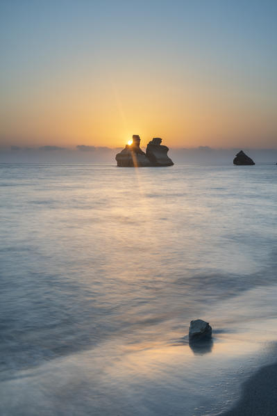 Torre dell'Orso, Melendugno, province of Lecce, Salento, Apulia, Italy, Europe. The Due Sorelle (Two Sisters) at sunrise