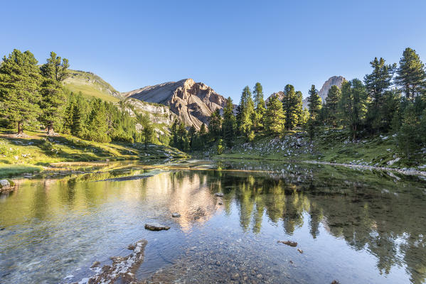 San Vigilio di Marebbe, Fanes, Dolomites, South Tyrol, Italy, Europe. The Piz de Sant Antoine is reflected in a lake in the natural park Fanes-Sennes-Braies