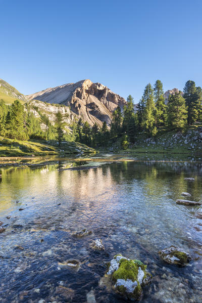 San Vigilio di Marebbe, Fanes, Dolomites, South Tyrol, Italy, Europe. The Piz de Sant Antoine is reflected in a lake in the natural park Fanes-Sennes-Braies