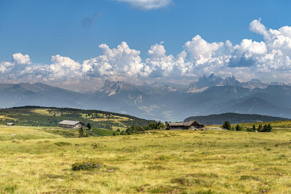 Villandro / Villanders, Bolzano province, South Tyrol, Italy. Alpine hut on the Villandro Alp withe the peaks of Sas de Putia and the Odle in the background