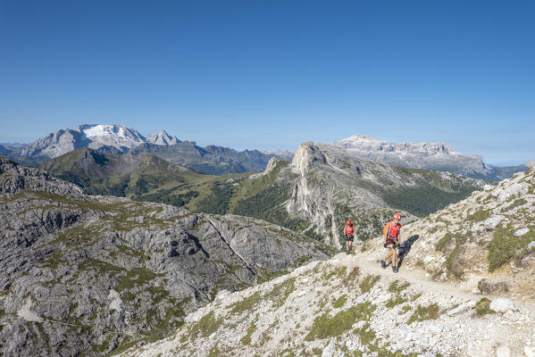 Falzarego Pass, Dolomites, province of Belluno, Veneto, Italy. Mountaineers approaching the via ferrata 