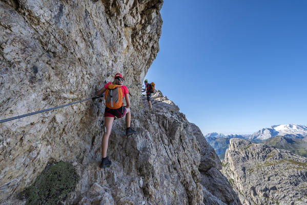 Falzarego Pass, Dolomites, province of Belluno, Veneto, Italy. Mountaineers on the via ferrata 