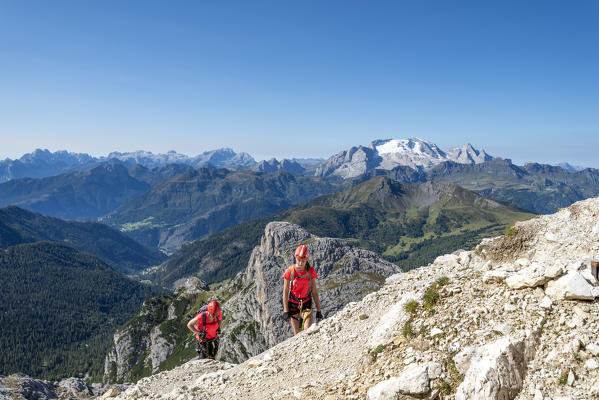 Falzarego Pass, Dolomites, province of Belluno, Veneto, Italy. Mountaineers on the via ferrata 