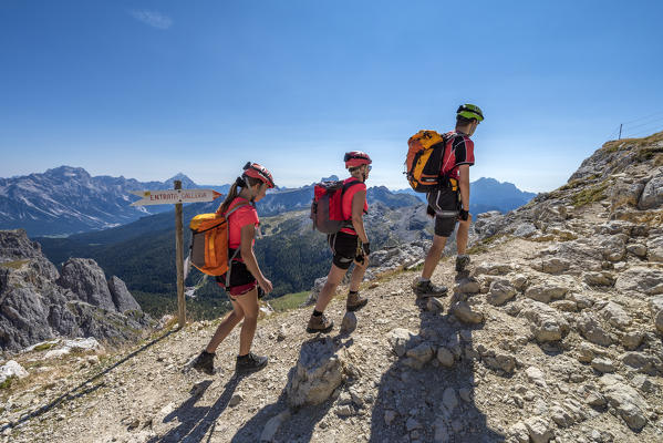 Falzarego Pass, Dolomites, province of Belluno, Veneto, Italy. Mountaineers on the path to the Lagazuoi war tunnel