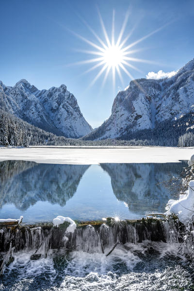 Dobbiaco/Toblach, province of Bolzano, South Tyrol, Italy. Winter at the Lake Dobbiaco, in the background the Mount Nasswand