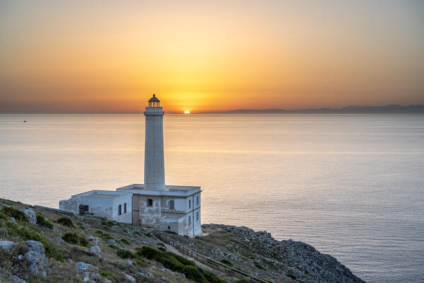 Otranto, province of Lecce, Salento, Apulia, Italy. Sunrise at the lighthouse Faro della Palascìa. This lighthouse marks the most easterly point of the Italian mainland.  In the background you can see mountains of Albania