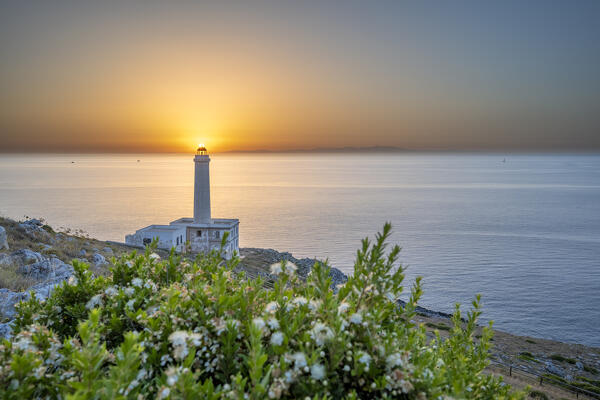 Otranto, province of Lecce, Salento, Apulia, Italy. Sunrise at the lighthouse Faro della Palascìa. This lighthouse marks the most easterly point of the Italian mainland.  In the background you can see mountains of Albania