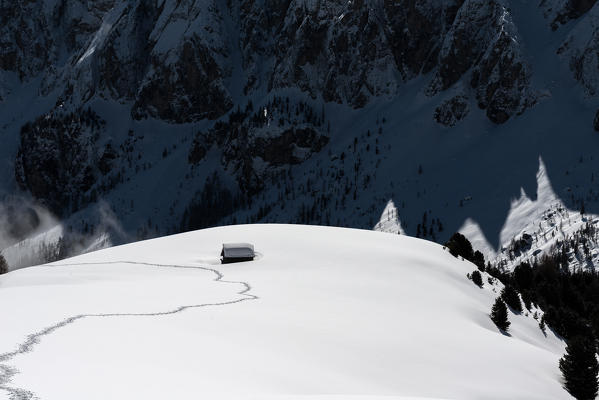 Alta Badia, Dolomites, South Tyrol, Italy. A trail in the snow of Medalges