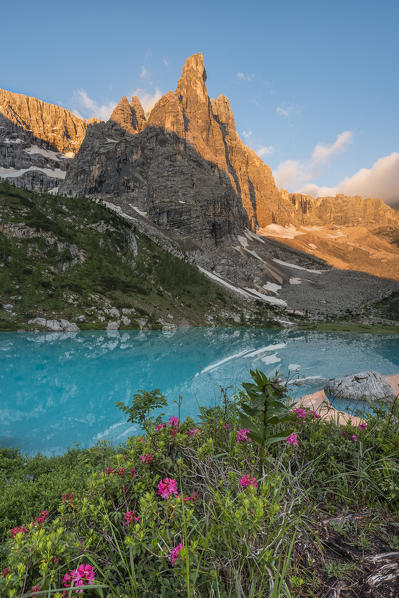 Sorapiss Lake, Dolomites, Veneto, Italy. Sunrise in the Sorapiss group. In the Sorapiss Lake reflected the Dito di Dio (God's Finger)