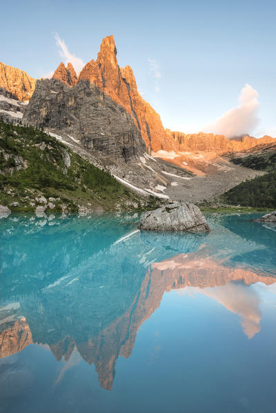 Sorapiss Lake, Dolomites, Veneto, Italy. Sunrise in the Sorapiss group. In the Sorapiss Lake reflected the Dito di Dio (God's Finger)