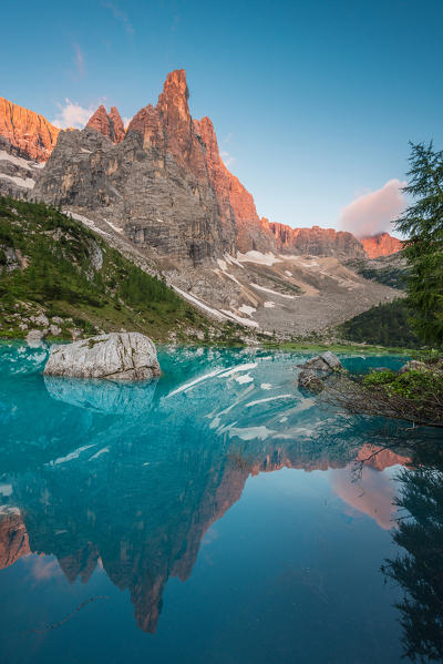 Sorapiss Lake, Dolomites, Veneto, Italy. Sunrise in the Sorapiss group. In the Sorapiss Lake reflected the Dito di Dio (God's Finger)