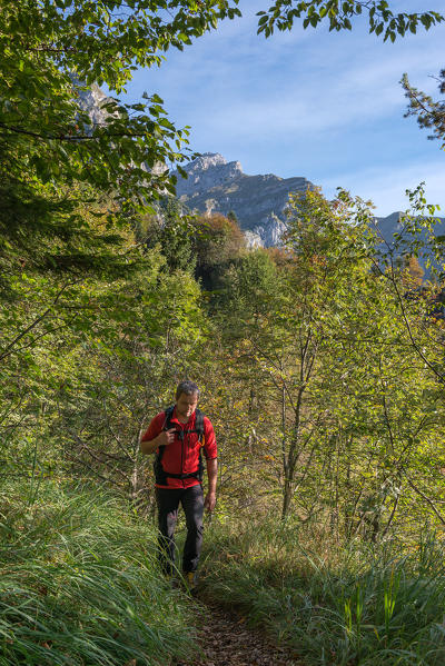 Cimonega, Dolomites, Veneto, Italy. Mointaineer on the ascent to the Passo Alvis