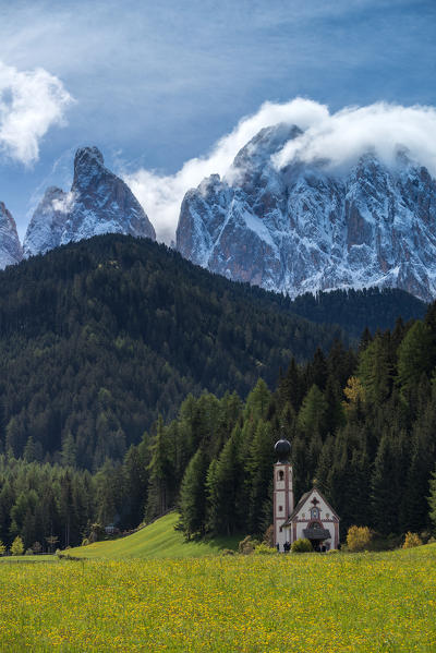 Funes Valley, Dolomites, South Tyrol, Italy. The church San Giovanni in Ranui and the peaks of the Odle