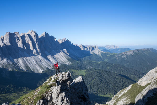 Odle di Eores, Dolomites, South Tyrol, Italy. Hiker on the Guenther Messner trail 