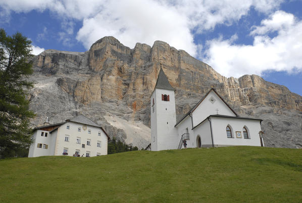 Alta Badia, Dolomites, South Tyrol, Italy. The Crusc, the church of Santa Croce in Alta Badia. In background the west face of Sasso di Santa Croce.