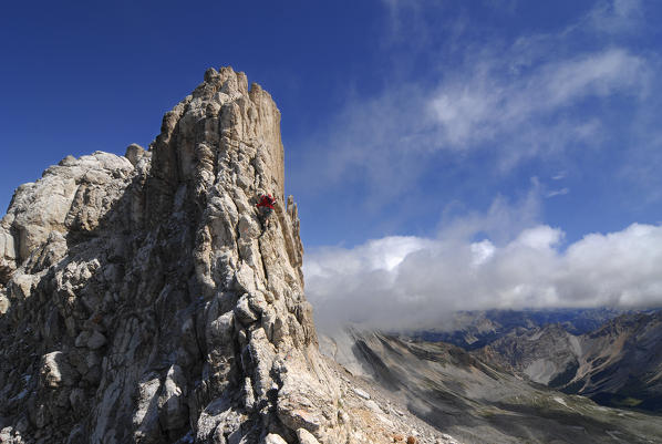 Alta Badia, Dolomites, South Tyrol, Italy. Climber on the via ferrata of the Cima Dieci / Zehnerspitze in the Dolomites of Fanes