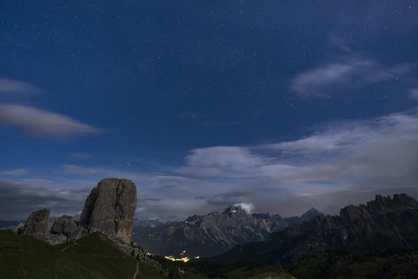 Cinque Torri, Dolomites, Veneto, Italy. Full moon night with stars over the peaks of Cinque Torri.