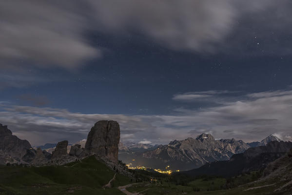 Cinque Torri, Dolomites, Veneto, Italy. Full moon night with stars over the peaks of Cinque Torri.