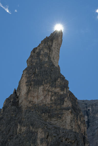 Antersasc, Dolomites, South Tyrol, Italy. The sun just above the crag Crep de l'Ora
