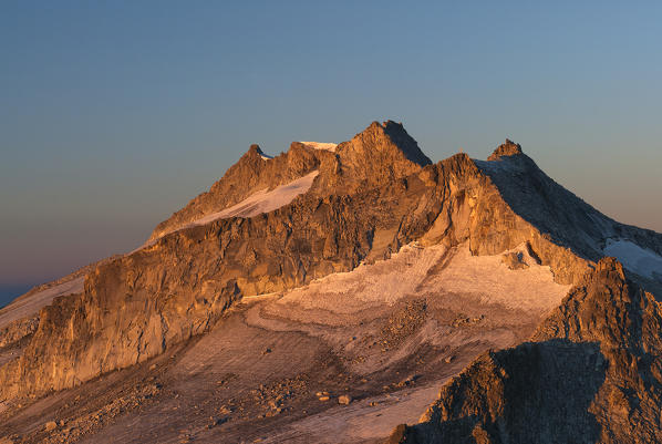 Adamello, Trentino, Italy. Alpenglow in the walls of the Cresta Croce