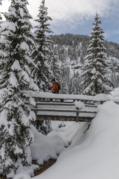 Prato Piazza, Dolomites, South Tyrol, Italy. Ski mountaineer in the snow-covered Stolla Valley in the ascent to Prato Piazza