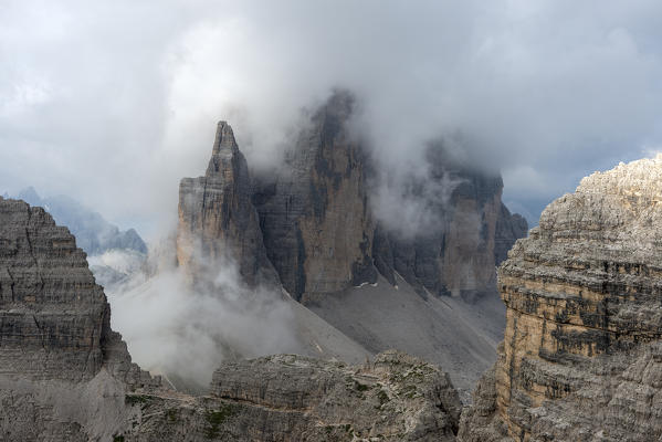 Sesto/Sexten, Dolomites, South Tyrol, Italy. Fog envelops the Tre Cime di Lavaredo / Drei Zinnen