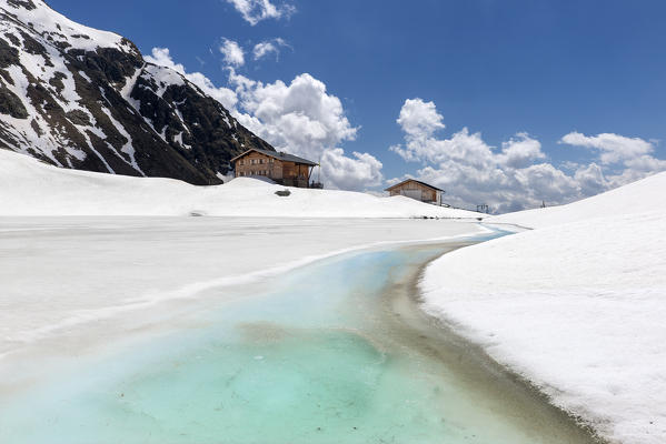 Terento, South Tyrol, Italy. The refuge Lago di Pausa / Tiefrastenhuette and the frozen lake