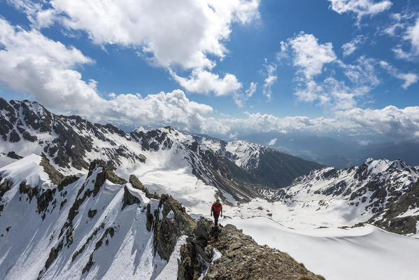 Terento, South Tyrol, Italy. Mountaineer along the ridge to Monte Gruppo / Hochgrubbachspitze. 