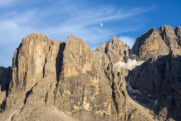 Sella, Dolomites, South Tyrol, Italy. The moon over the peak od Sas da Lech