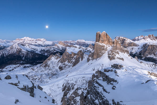 Nuvolau, Dolomites, Veneto, Italy. Blue hour and full moon  in the Dolomites with the peaks of Sella mountain Group and the Averau