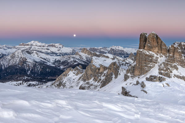 Nuvolau, Dolomites, Veneto, Italy. Twilight and full moon  in the Dolomites with the peaks of Sella mountain Group and the Averau