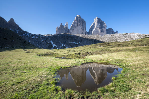 Sesto/Sexten, Dolomites, South Tyrol, Italy. The Tre Cime di Lavaredo/Drei Zinnen are reflected in a lake